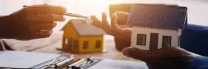 Property owner presenting and consulting customer to sign lease agreement.